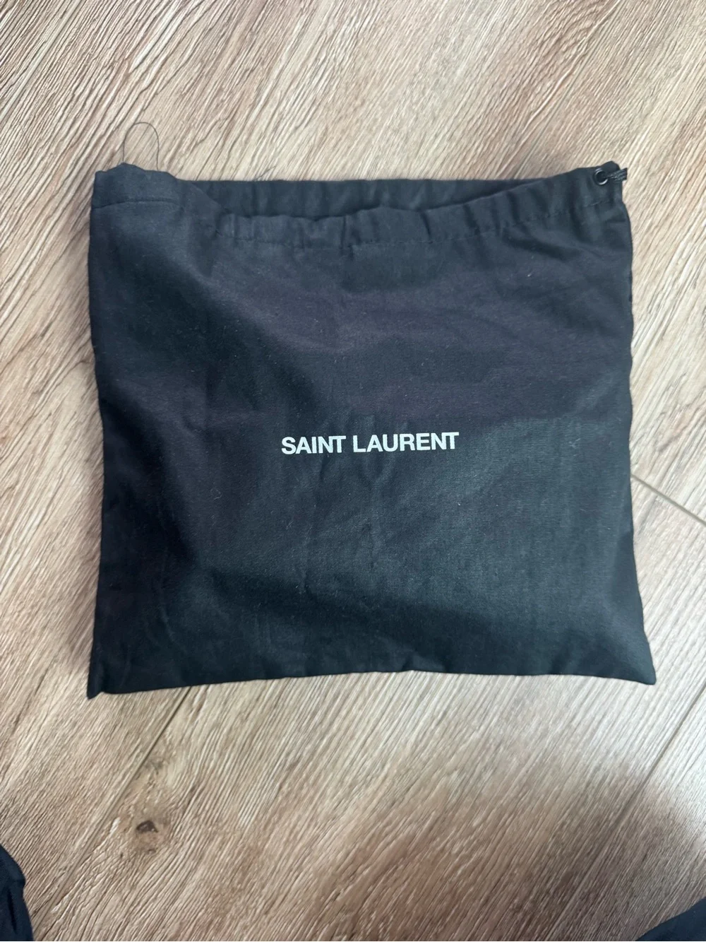 Saint Laurent Black Quilted Lambskin Clutch with Gold YSL Accent
Small 8”x 5” - Picture 2 of 6